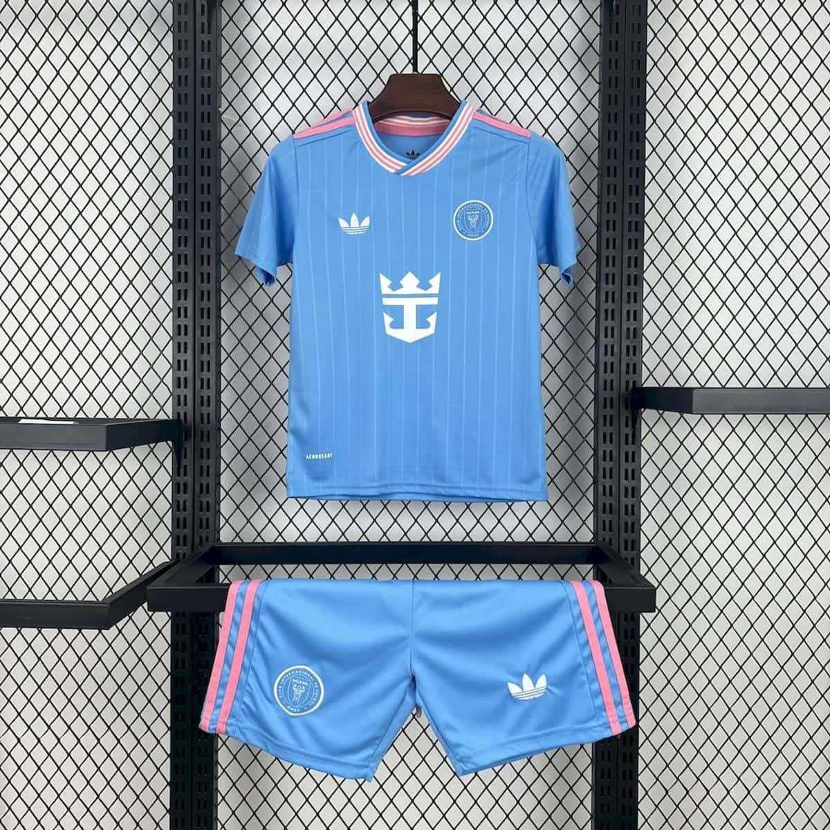 Blue soccer jersey on a hanger with pink-white striped collar, white Adidas logo, and circular crest on the chest, hanging in a metal rack.