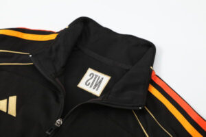 Black zip-up jacket with orange and yellow stripes along the sleeves and a small emblem on the chest near the zipper.