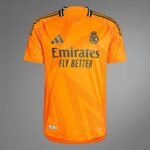 28lEgSJ5OZAIDsI | UAE SPORT STORE Orange Real Madrid jersey with Emirates Fly Better sponsor and Adidas logo on the chest, featuring club crest on the right side.