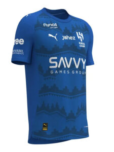 Blue sports jersey with a geometric pattern and multiple sponsor logos, including Savvy Games Group on the chest