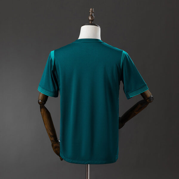 Back view of a teal short-sleeve athletic jersey on a dress form mannequin