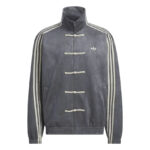 Gray track jacket with Chinese knot closures, cream sleeve stripes, and a small Adidas trefoil logo on the left chest.