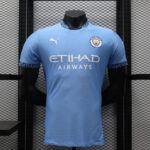 Manchester City home football jersey on a display mannequin, light blue with Etihad Airways sponsor and Puma logo.