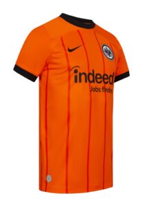 2MOgMYyyaTOIS1v | UAE SPORT STORE Bright orange football (soccer) jersey with black collar and cuffs, vertical red pinstripes, team crest on the chest, and the sponsor logo 'indeed' across the front.
