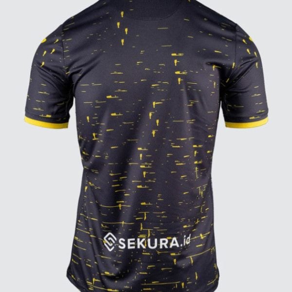 Back view of a dark navy athletic jersey with yellow speckle pattern, yellow sleeve cuffs, and a SEKURA.id logo near the lower back.