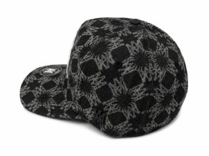 2a0a00d0-58ab-44f9-9afe-dde1a5a129e9 | UAE SPORT STORE Black baseball cap with a black-and-gray floral pattern and a round logo patch on the brim, shown from a side angle.