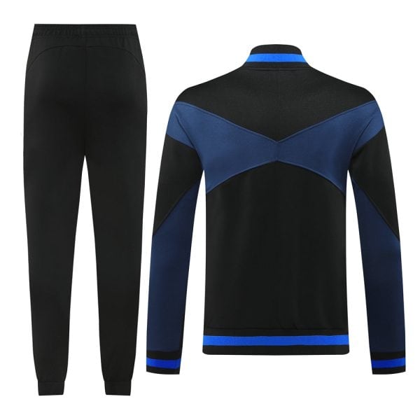 Back view of a black athletic tracksuit with blue color-blocked jacket and matching blue trim on cuffs and hem, paired with plain black jogger pants.