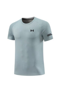 Light blue short-sleeve Under Armour athletic shirt with perforated mesh fabric and logos on chest and sleeve.