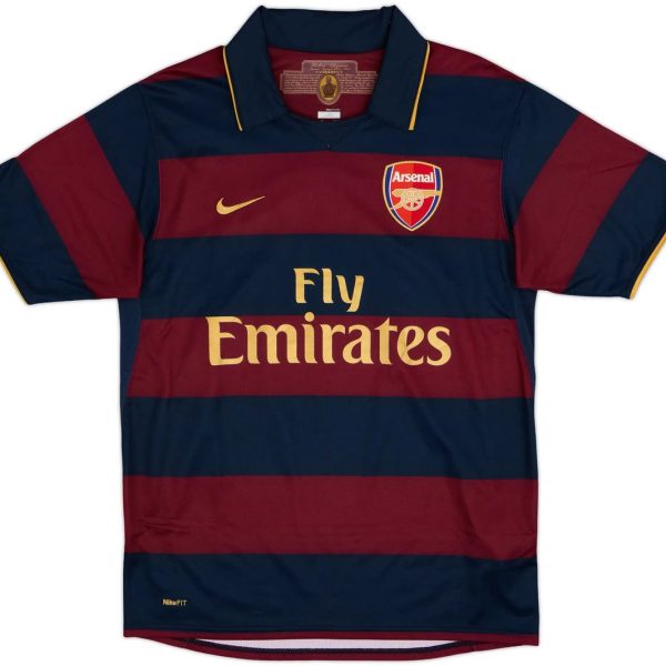 Arsenal football jersey with navy and maroon horizontal stripes, Nike logo, crest on the chest, and Fly Emirates sponsor text in gold.