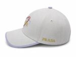 Lavender Prestige Cap with Prada logo and colorful embroidery.