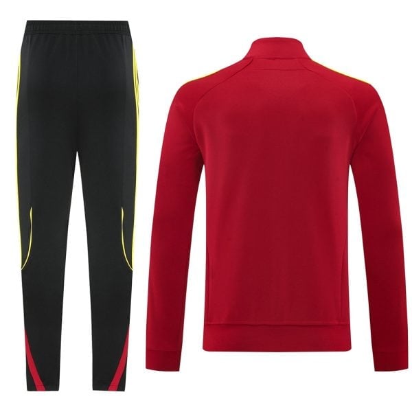 Red athletic track jacket and black training pants with yellow piping, part of a sports tracksuit set.