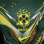 Close-up of the Brazil national football team crest on a green jersey with yellow accents.