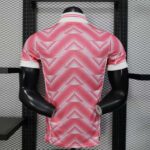 2e7d0d1e-baf1-481e-a06f-548c498f83c5 | UAE SPORT STORE Mannequin wearing a pink geometric-pattern polo shirt displayed in a store window