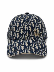 Navy and beige Dior monogram baseball cap with a gold 'Dior' logo on the front.
