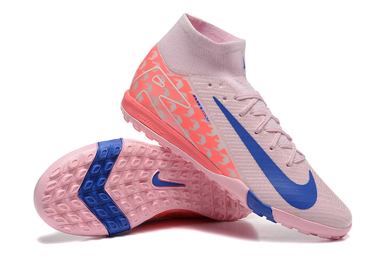 2fa58fef | UAE SPORT STORE Pair of pink Nike soccer cleats with a blue swoosh, high-top collar, and lace closure, shown from side and bottom angles to display outsole pattern.