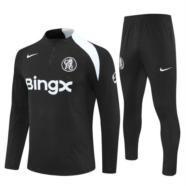 Black training jersey and matching pants set with Nike logos and BingX sponsor, in a dark design with a white shoulder stripe and club crest on the chest and pants.