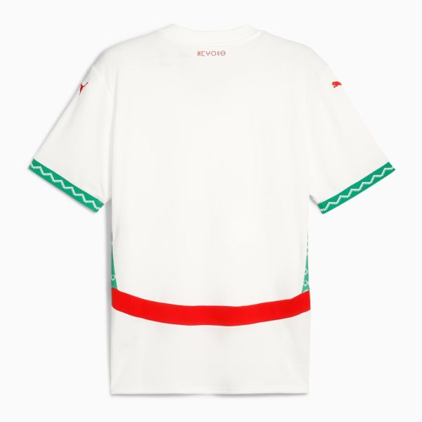Back view of a white T-shirt with green zigzag cuffs and a wide red bottom band.