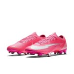 Pink Nike Mercurial soccer cleats, side-by-side, highlighting textured upper and white swoosh logo