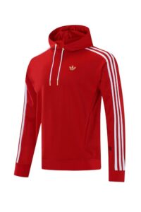 Red Adidas hoodie with white striped sleeves, gold trefoil logo, and white drawstrings on a hooded front.