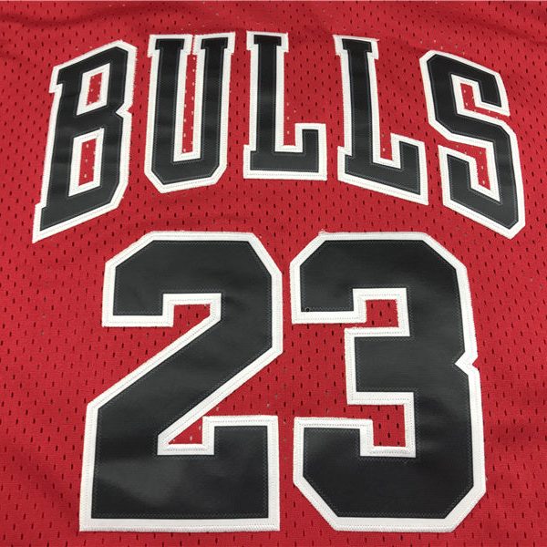 Red Chicago Bulls basketball jersey with the name 'BULLS' and the number 23 visible on the back.
