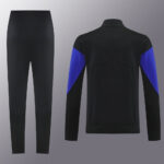 Black athletic tracksuit set with blue panel accents on the sleeves; front jacket/back view shown with elastic waistband pants nearby for scale.
