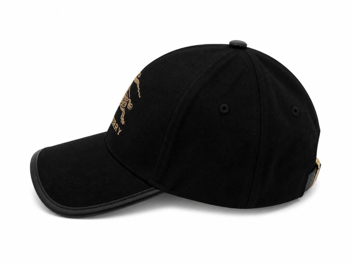 Black baseball cap with curved brim and gold embroidery on the front panel?
