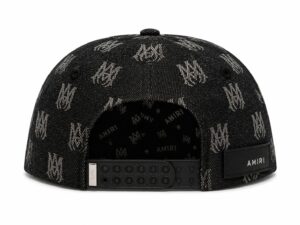 34ff7c88-60eb-4e0f-9ede-0ce48bed48d9 | UAE SPORT STORE Back view of a black denim cap with an all-over AMIRI logo pattern, featuring an adjustable snap strap and a stitched AMIRI patch on the back.