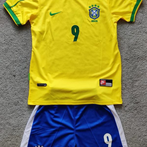 Brazil national football team kit: yellow jersey with green trim and number 9, blue shorts with Brazil crest and white side panels.
