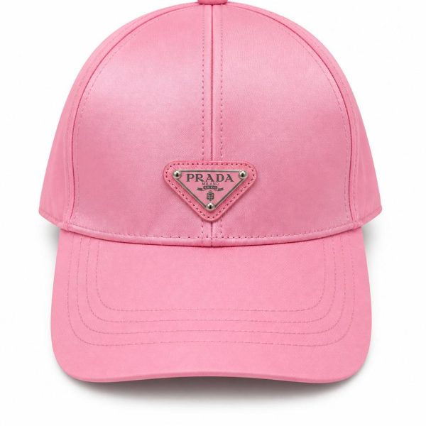 Pink baseball cap with a small Prada logo plaque on the front panel.