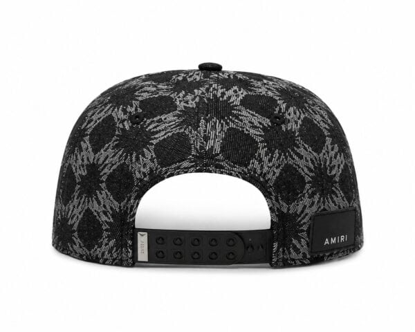 Stylish black monogram cap featuring a unique pattern and adjustable strap for a perfect fit.