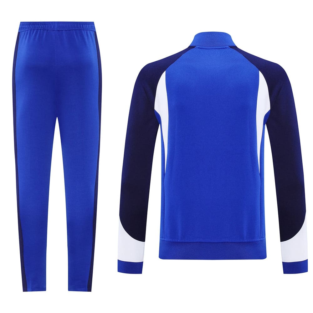 36cbb371 | UAE SPORT STORE Blue tracksuit set with matching pants and a blue jacket featuring navy sleeves and white side panels on the jacket.