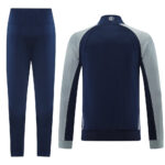 36d53a6a | UAE SPORT STORE Navy blue tracksuit with light gray raglan sleeves: jacket and matching navy pants.