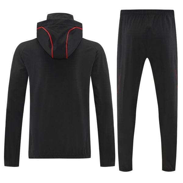 Back view of a black hoodie with red piping along the hood seams, paired with black pants with subtle piping details.