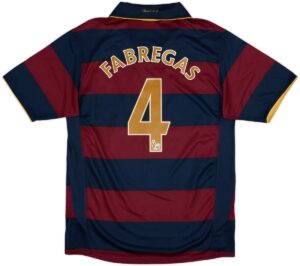 Soccer jersey with wide blue and maroon horizontal stripes, name Fabregas and large gold number 4 on the back.