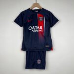 Navy Paris Saint-Germain jersey on a hanger, with a red vertical stripe, PSG crest, Nike swoosh, and Qatar Airways sponsor.