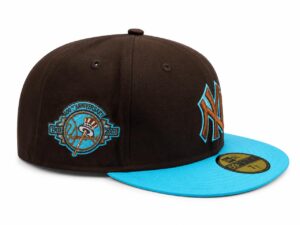 New York Yankees cap with a bright blue brim and brown crown, featuring teal embroidery and a commemorative anniversary patch on the side.
