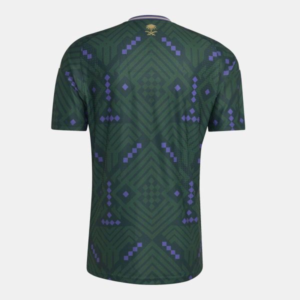 Back view of a dark green geometric-pattern soccer jersey with purple diamond accents and a gold crest at the collar.
