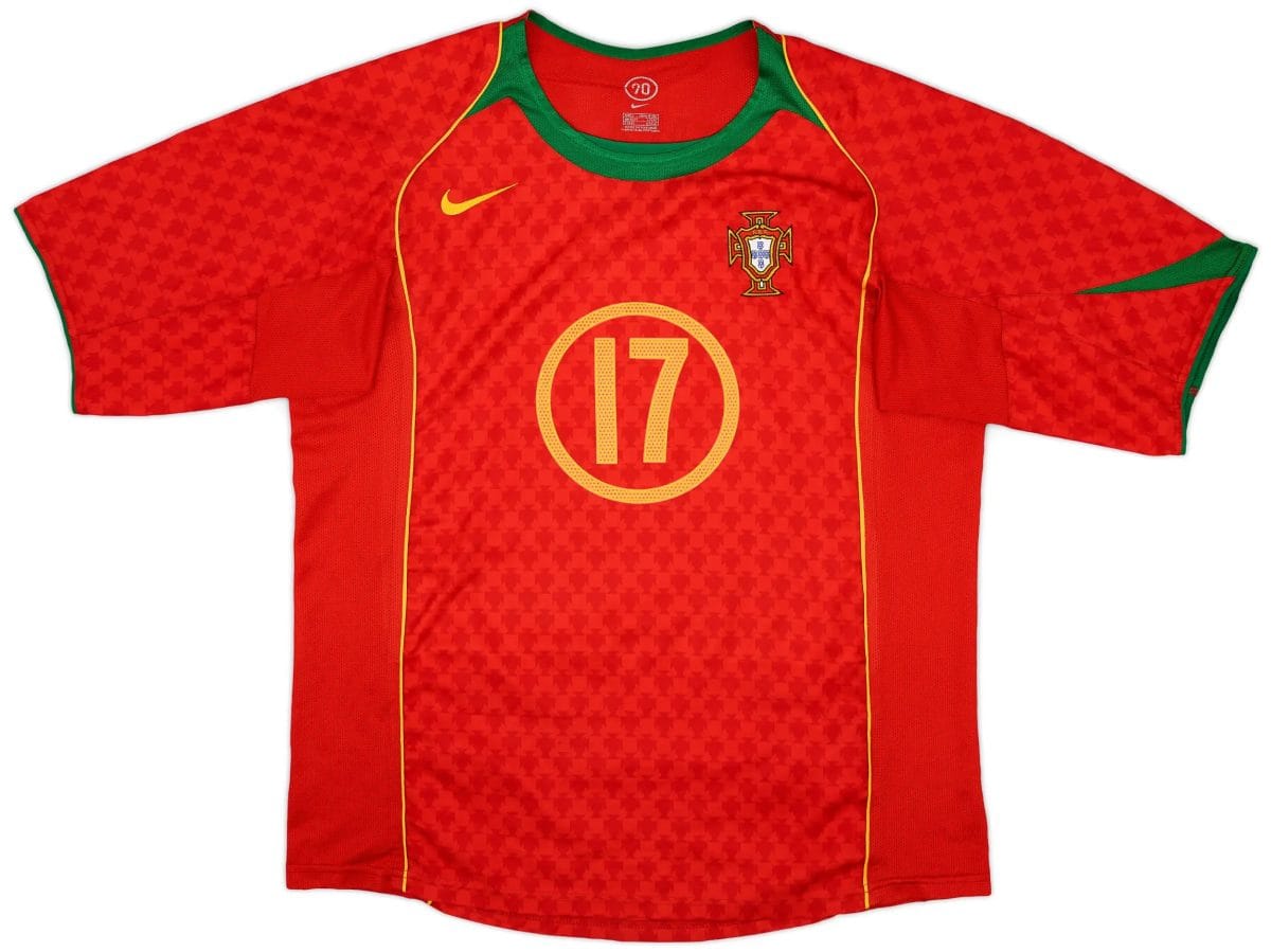 Portugal national football jersey in red with a green collar and yellow trim, featuring a crest on the left chest and a large yellow 10 on the front.