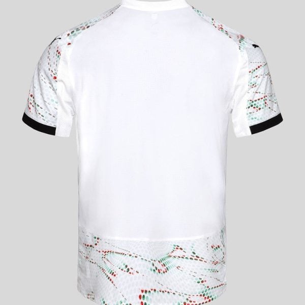 Back view of a white athletic jersey with patterned mesh panels on shoulders and hem, and black sleeve cuffs.