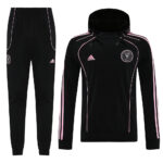 Black Adidas tracksuit set with pink piping, hooded jacket and matching jogger pants.
