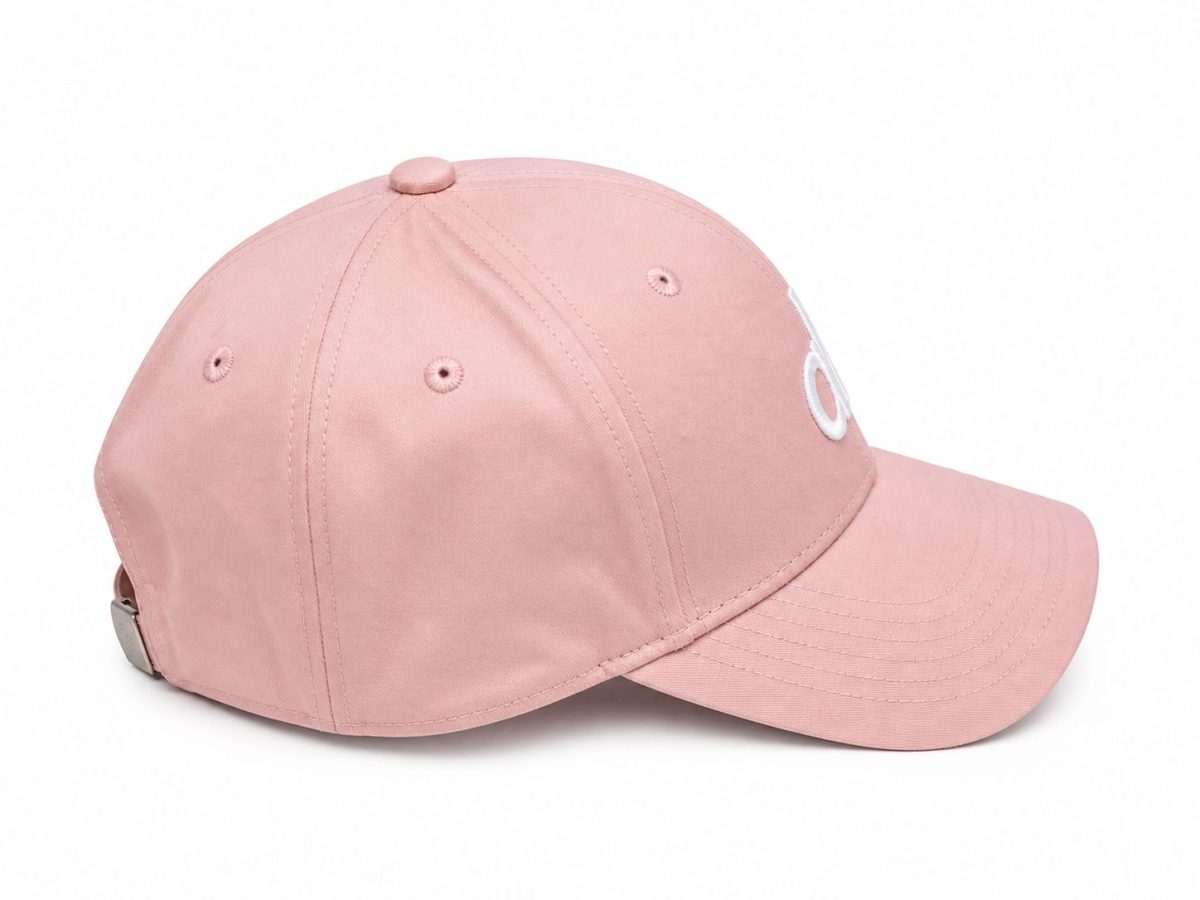 Pink baseball cap with curved brim on a white background, showing top button and stitched panels.