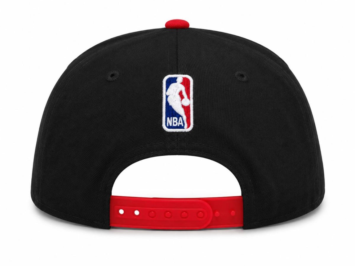 Black baseball cap viewed from the back with a red adjustable strap and an NBA logo patch on the center rear panel.