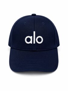 Navy blue baseball cap with a white embroidered 'alo' logo on the front.