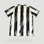 T-shirt with bold black-and-white vertical stripes and abstract brush patterns, short sleeves, back view shown