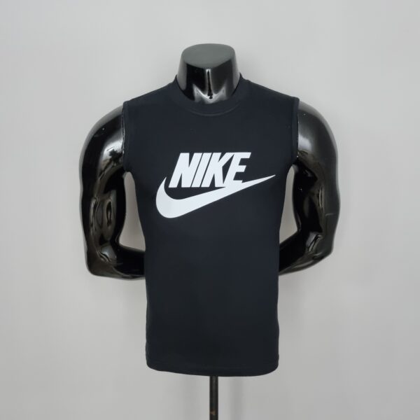 Front view of a black Nike sleeveless tank top on a glossy mannequin bust with the white Nike swoosh logo visible on the chest.