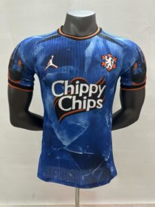 3eb11d69 | UAE SPORT STORE Blue soccer jersey on a display bust with orange trim and the 'Chippy Chips' sponsor logo across the front.
