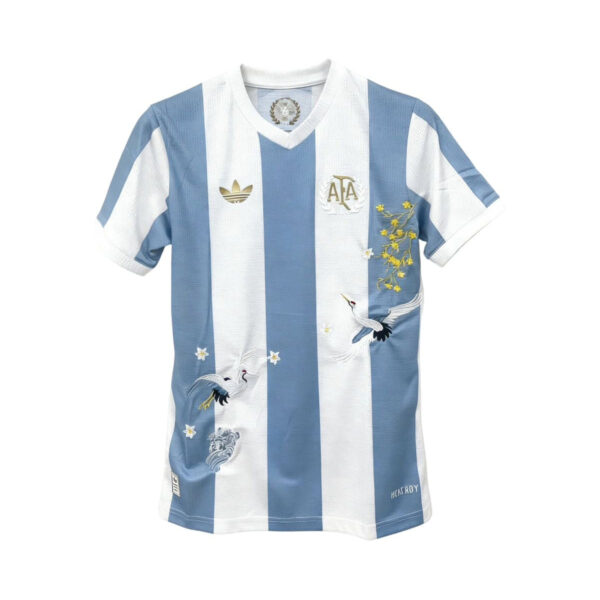 Blue and white striped soccer jersey with crane embroidery and a crest on the chest, front view.