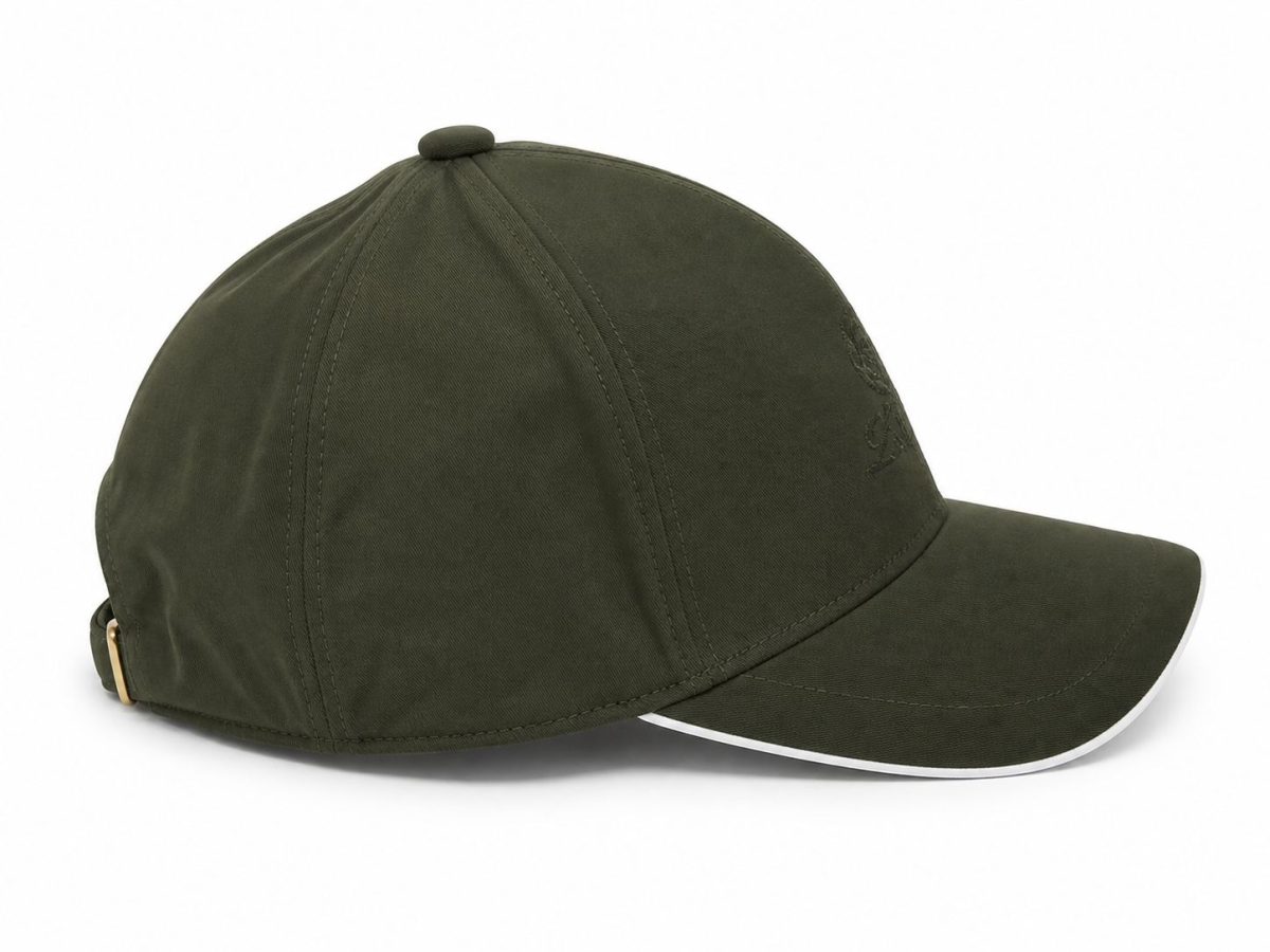 Olive green baseball cap shown from the side, with a white-trimmed curved brim and back strap.