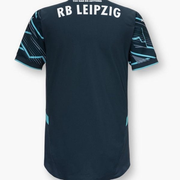 Back view of a dark navy RB Leipzig jersey with teal geometric sleeves and the text 'RB LEIPZIG' across the shoulders.
