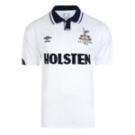 White polo shirt with a navy collar featuring a large HOLSTEN sponsor logo across the chest and a crest on the left, plus an Umbro badge on the right shoulder area; FA Cup Final 1991 detail visible.